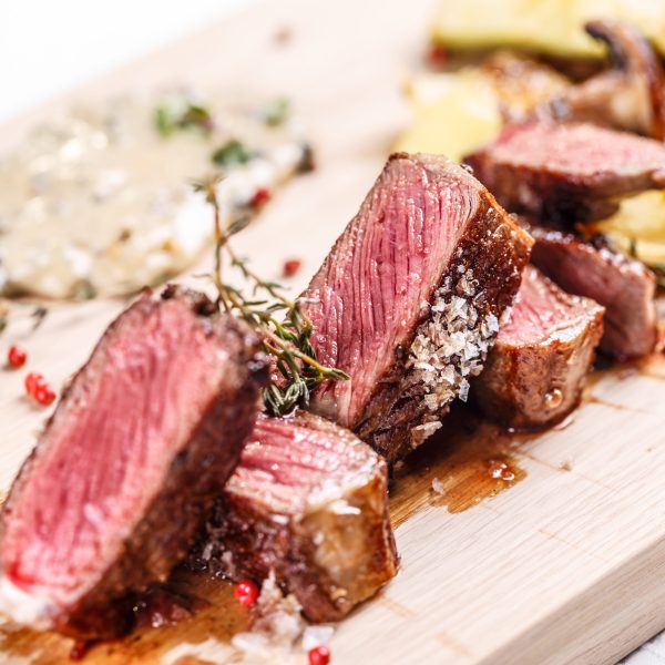 Beef steak Beef steak on a wooden board, fine dining