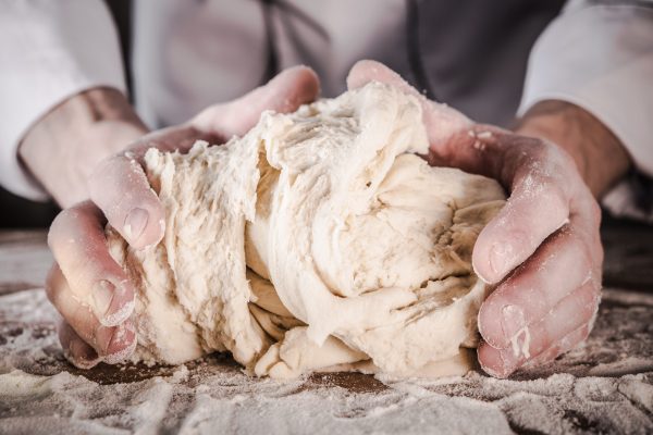 Preparing Bread Dough Preparing Bread Dough by Caucasian Men in His 30s.
